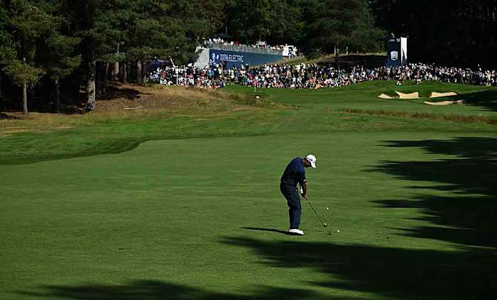 Ireland's Padraig Harrington plays a shot from the 13th fairway on day one of the 2023 BMW PGA Championship at Wentworth Golf Club.
